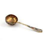 Russian silver spoon strainer with enamel decor.