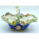 Porcelain vase-basket with molded flowers.