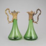 A pair of Art Nouveau jugs.