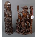Zwei unterschiedliche Holzschnitzereien. Afrika / Asien 20. Jh., H=35 / 55 cm.