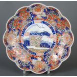 Imari-Platte. Japan. Porzellan, unterglasurblau bemalt, reich farbig überdekoriert, D=35,5 cm. (