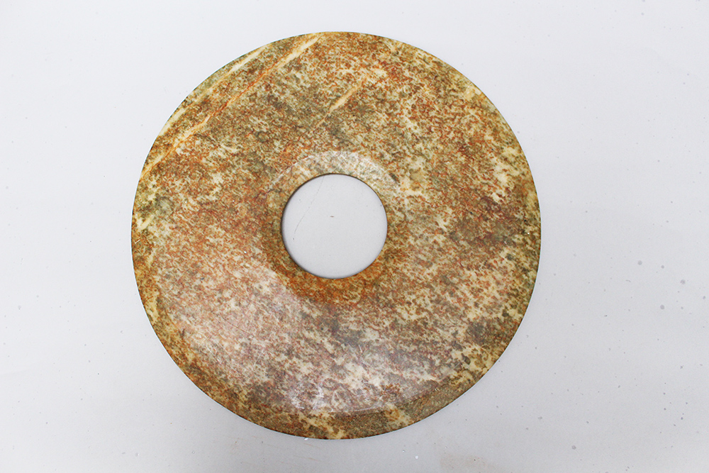 A Jade Bi plate, canted, polished Qing Dynasty. 40 cm diameter - Image 2 of 3