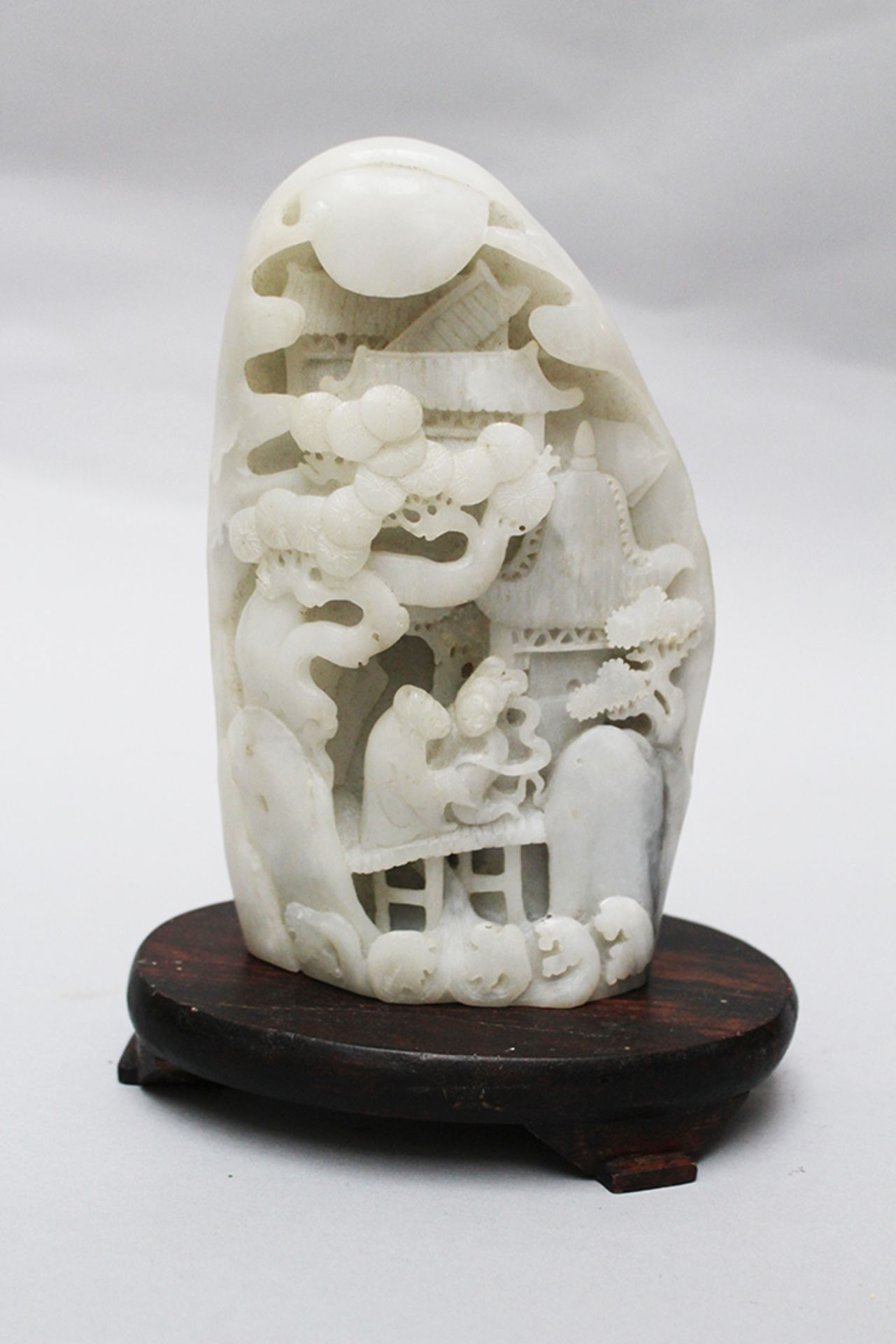 White Jade sculpture, curved on wooden base , Qing Dynasty. 20 cm height
