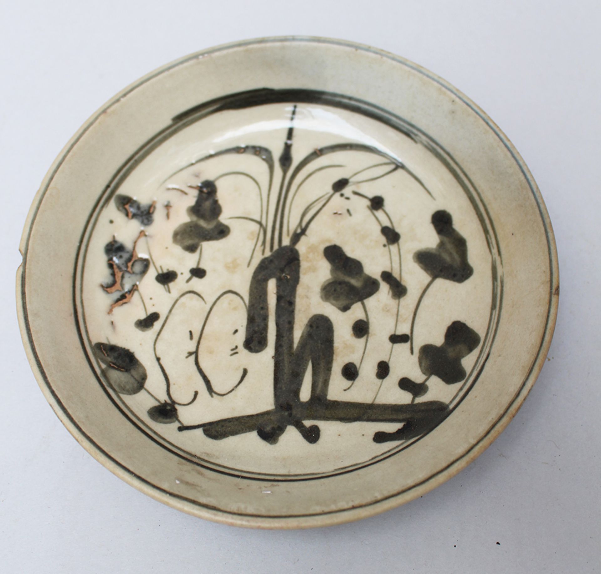 Asian porcelain dish , black painted on grey ground glazed , Ming period. 17 cm diameter