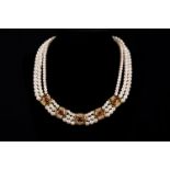 Pearl Necklace in three lines with gold 585 with diamonds of 0,5 carat and rubies, akoya pearls .