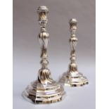 Pair of silver candlesticks, round turned and thickened design; Belgium Leuuven, Louvain, dated