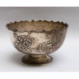 Silver bowl, round shape with curved border on central round feed chased with flowers and leaves,