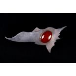 Brooch in silver 925/1000, with red stone; around 1960. 24g, 10.5x5.5cm