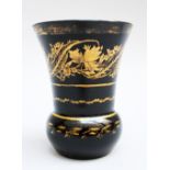 Bohemian black glass spa beaker with gilded decorations, around 1830, height 11cm.