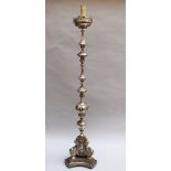 Monumental particular Italian baroque candlestick, with rich ornamental and figural decorations,