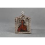 Russian medallion icon; arched top, richly engraved, with painted saints in the centre; on the