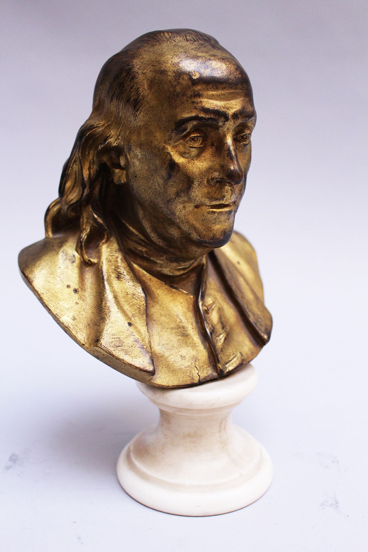 Benjamin Franklin (1706-1790) bust , bronze cast with fine hand finish gilded on white marble