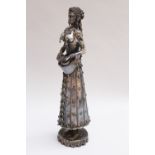 Oriental silver tambourine figure, of a female in traditional dress, on round base, with tazzles ,