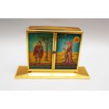 Im Hof Desktop clock in triptych shape with to be opened doors, bronze gilded case with Limoges