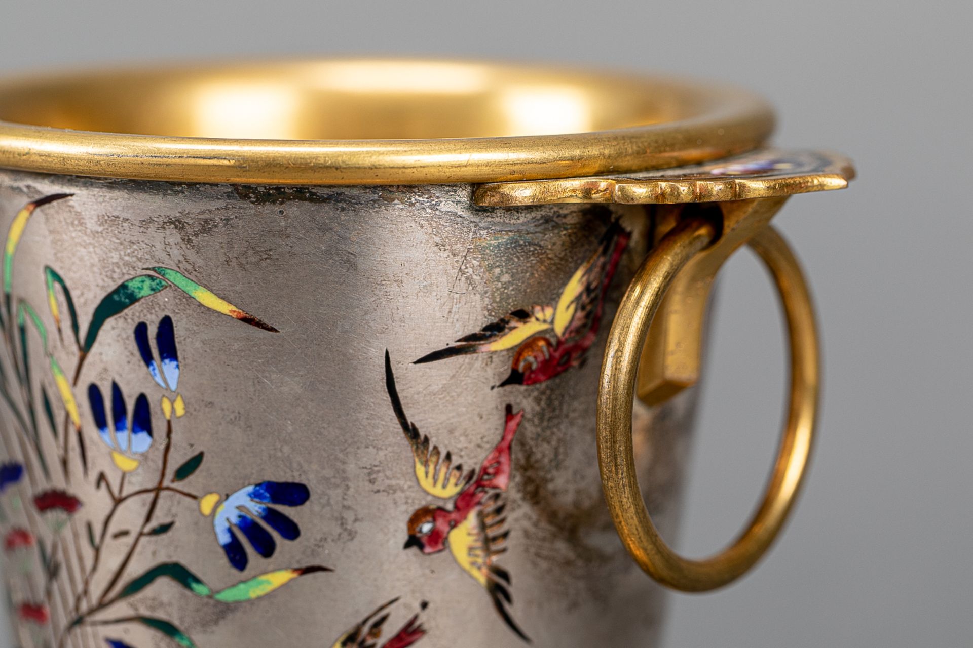 Presentation cup on round base metal silvered and gilded with multi coloured enamels birds and - Image 3 of 3