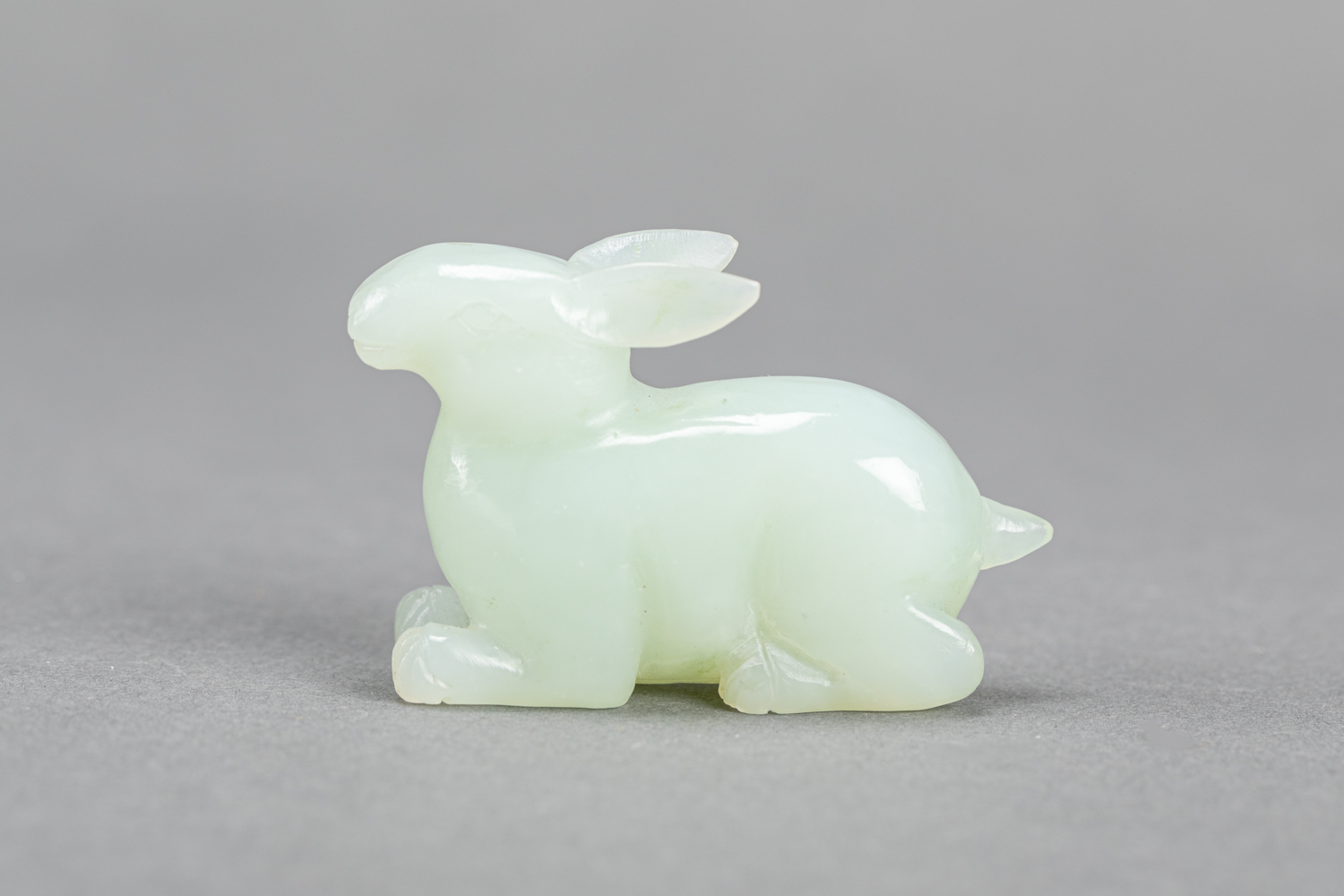 Jade hare sculpted in naturalistic manner , light green collour , Qing Dynasty