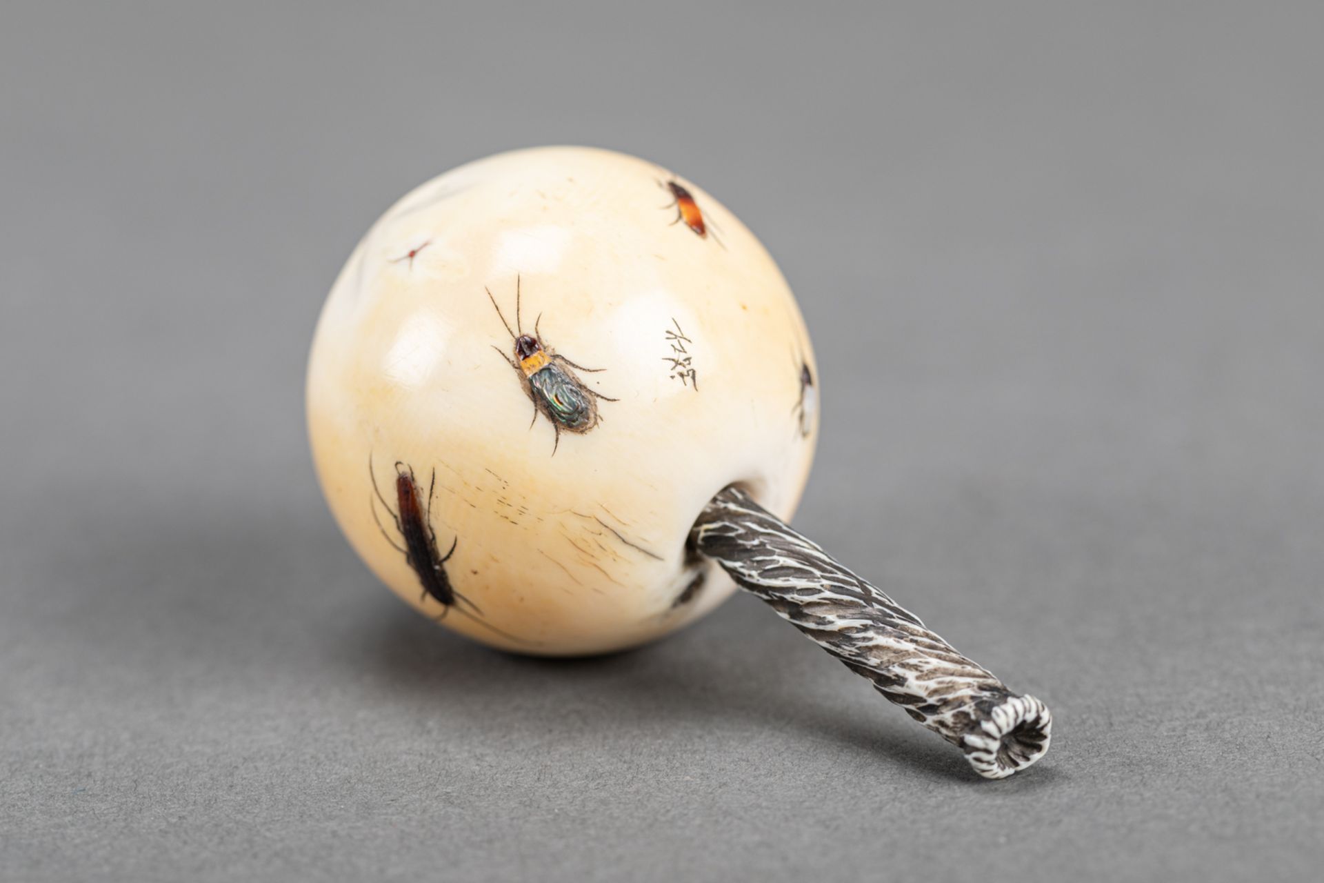 Asian Okimono in form of a round fruit with bugs; I. carved with mother of pearl and other