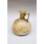 Early glass flask , round shape with handgrip and long neck, green transparent glass , possible