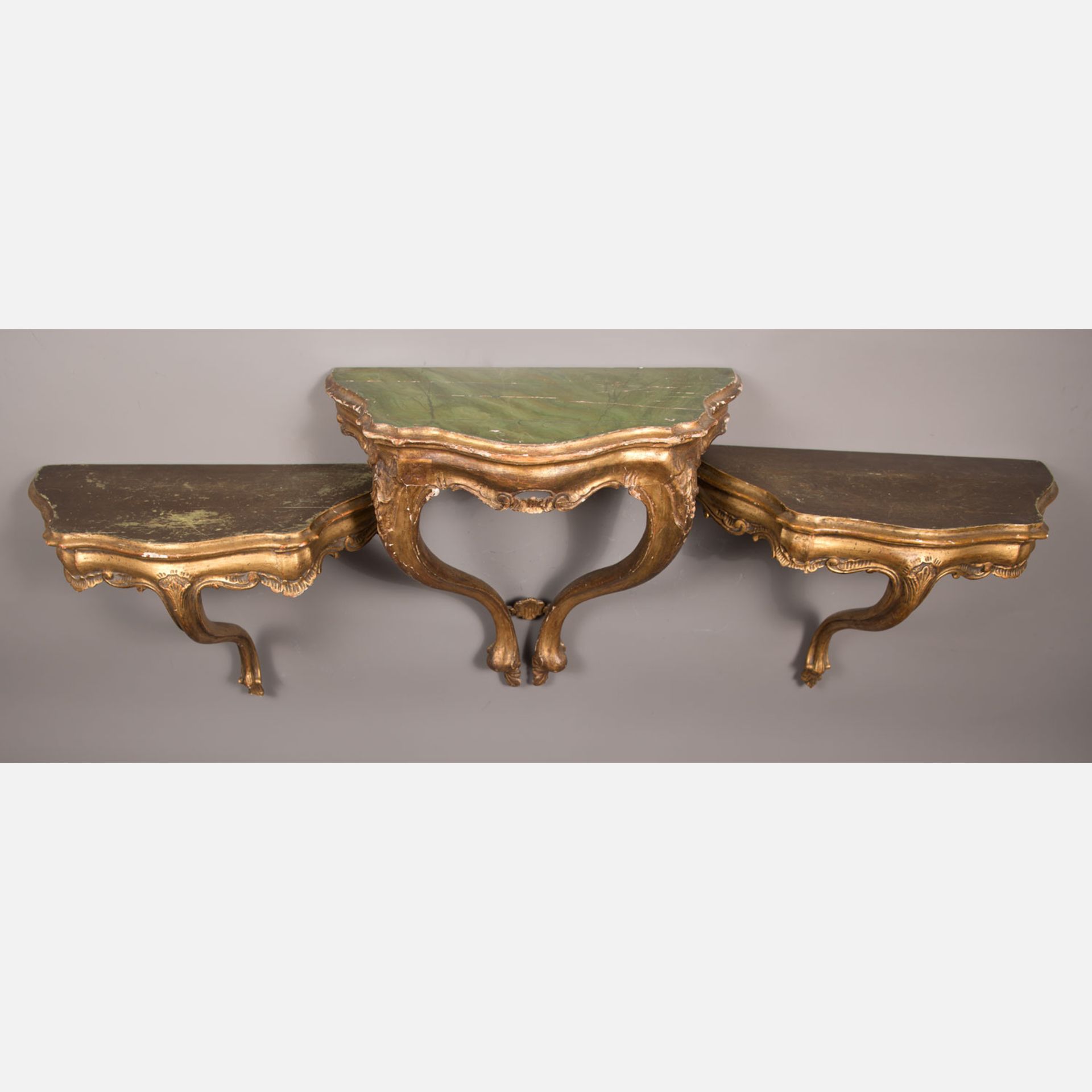 A set of three Venetian wall consoles