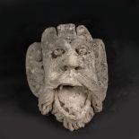 Grotesque male stone hat