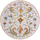 ANGELO MINGHETTI, Bologna, XX secolo. Piatto in ceramica policroma. Diametro cm 28,5. (lievi