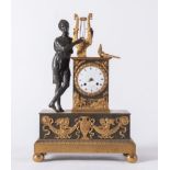 OROLOGIO in bronzo dorato con allegoria della Musica. Prima metà del XIX secolo. Reca firma sul quad