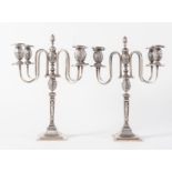 COPPIA DI CANDELABRI in argento 800. Sul bordo inferiore recano punzoni: Alfonsi G. Roma, stemma, 80