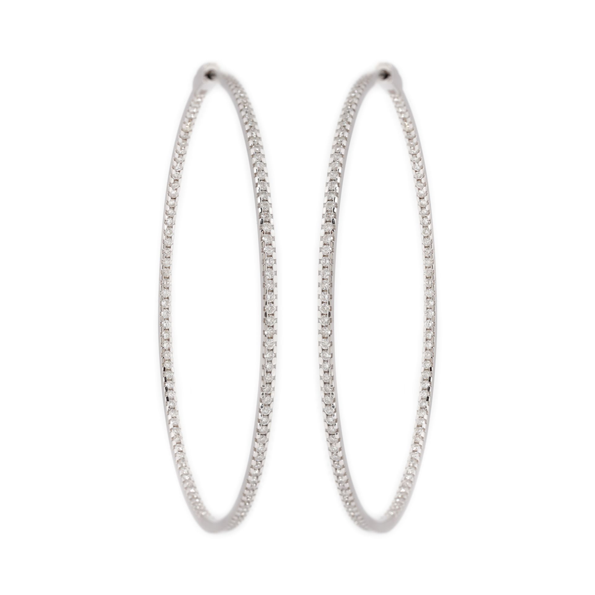 Pair of circular earrings, white gold, decorated with diamonds