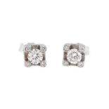 Pair of white gold earrings decorated with diamonds