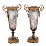 French workshop, Pair of Sèvres decorative vessels, made of porcelain and gilded bronze, decorated w