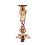 European workshop, Majolica pedestal, richly decorated with flowers and putti in love, late 19th cen