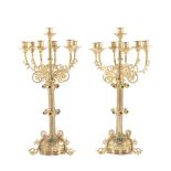 French workshop, Pair of Charles X candlesticks, doré bronze in two colours, adorned with cabochon c