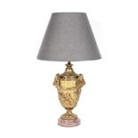 Doré bronze lamp and red marble base, decorated with satyrs, putti and laurel wreaths