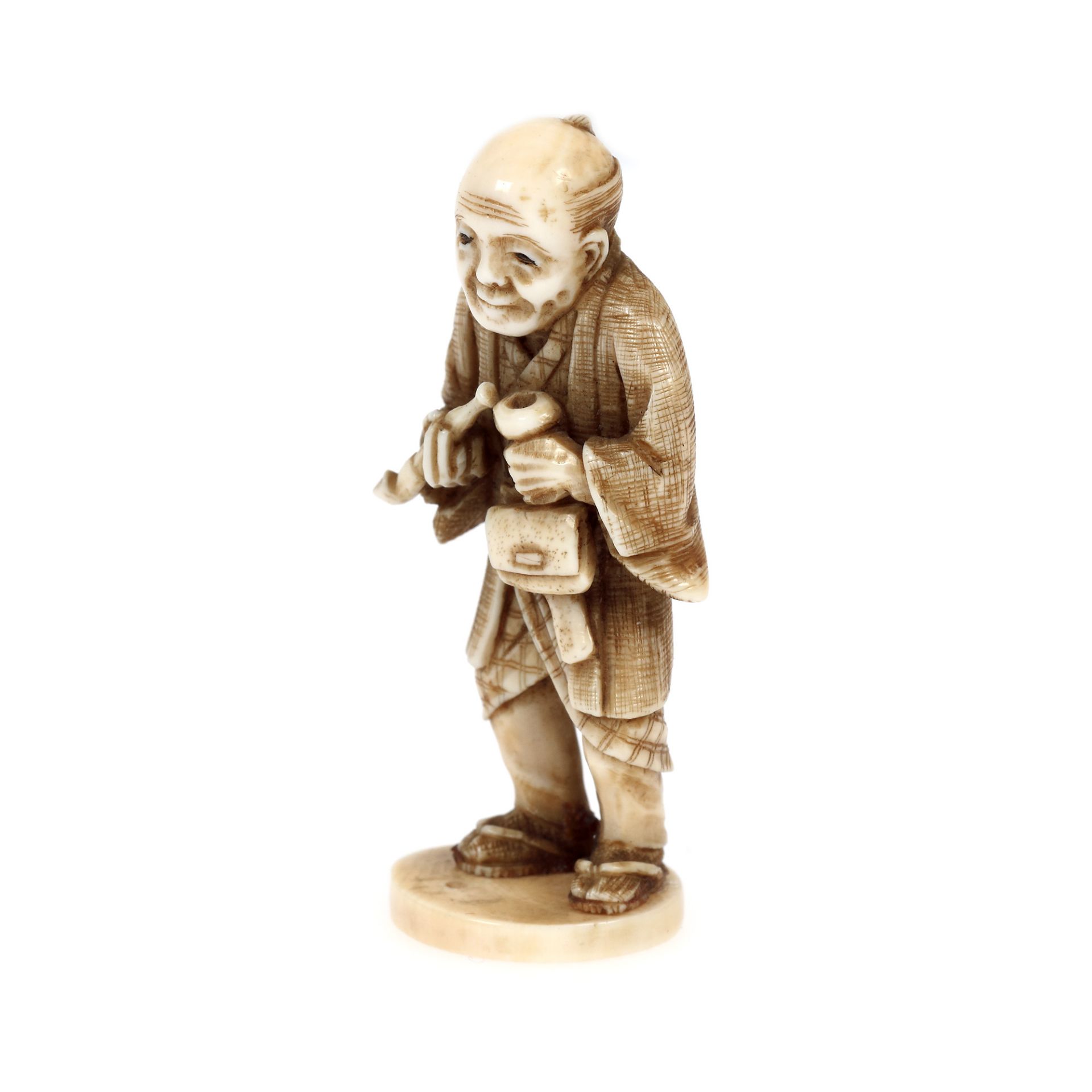 Ivory Netsuke, depicting an old man preparing his pipe, signed, Japan, late 19th century - Image 2 of 4