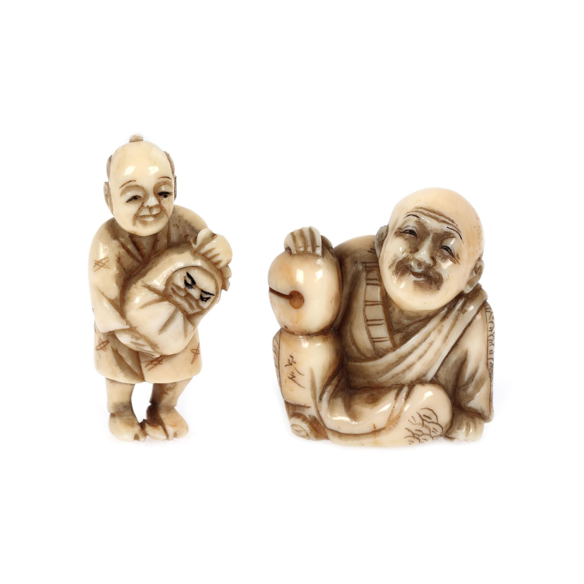 Pair of ivory netsuke, signed, depicting a seated old man and a parent with a child in their arms, J