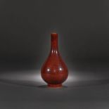 Porcelain bottle vase, with copper-red glaze with metallic pigments, marked Kangxi, Kangxi period, C