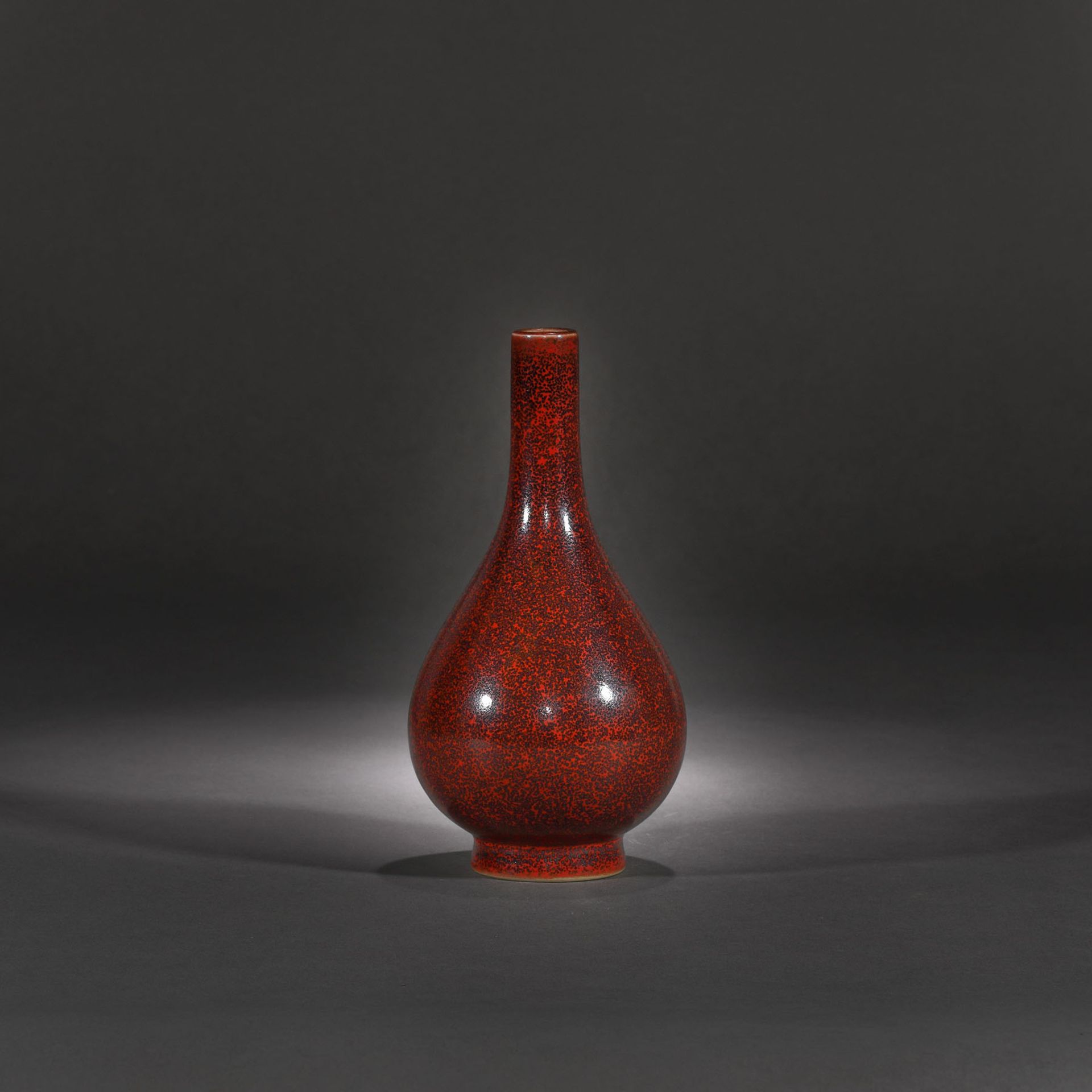 Porcelain bottle vase, with copper-red glaze with metallic pigments, marked Kangxi, Kangxi period, C