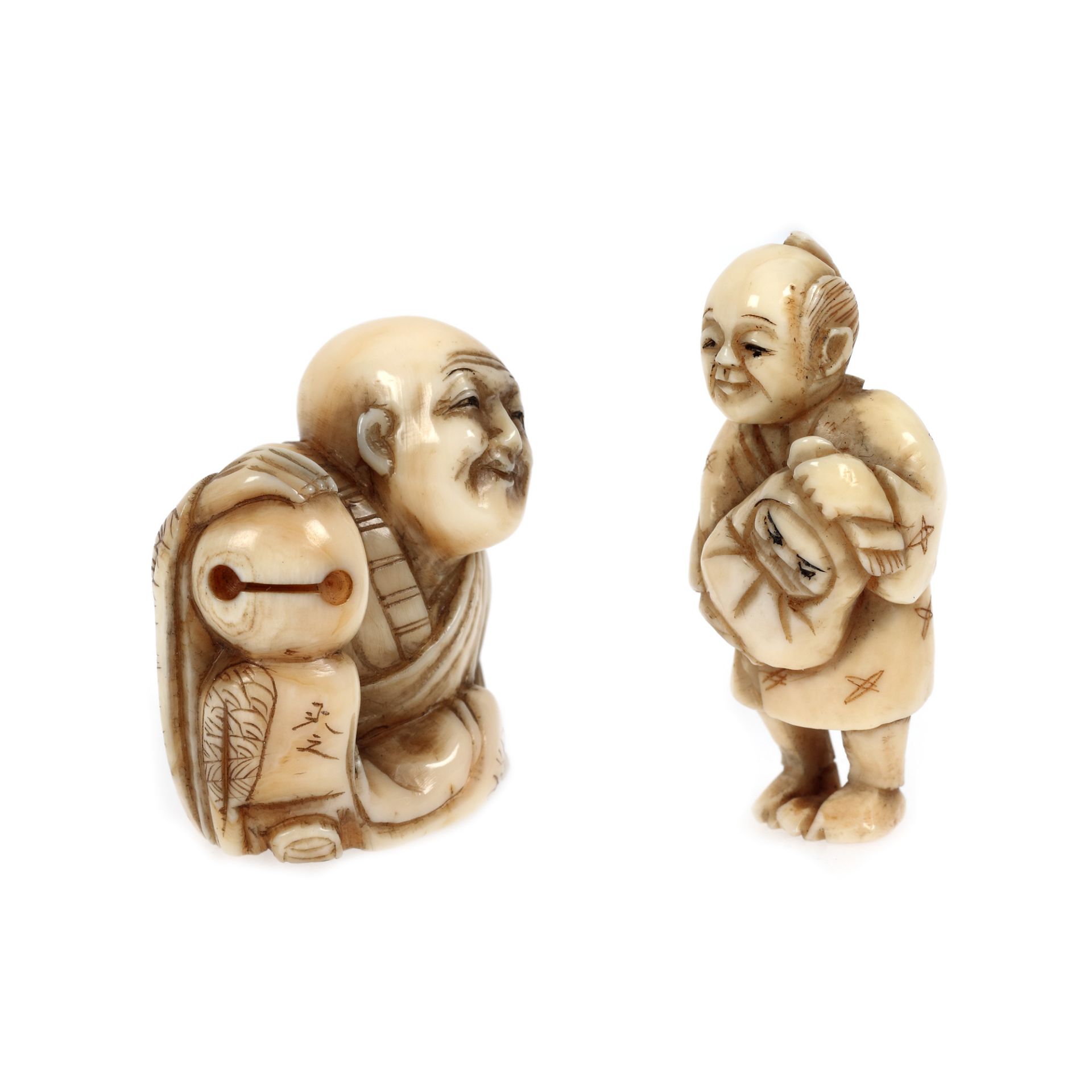 Pair of ivory netsuke, signed, depicting a seated old man and a parent with a child in their arms, J - Image 2 of 4