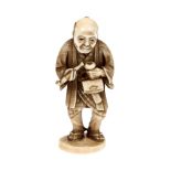 Ivory Netsuke, depicting an old man preparing his pipe, signed, Japan, late 19th century