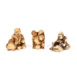 Three netsuke, representing a family, Japan, late 19th century