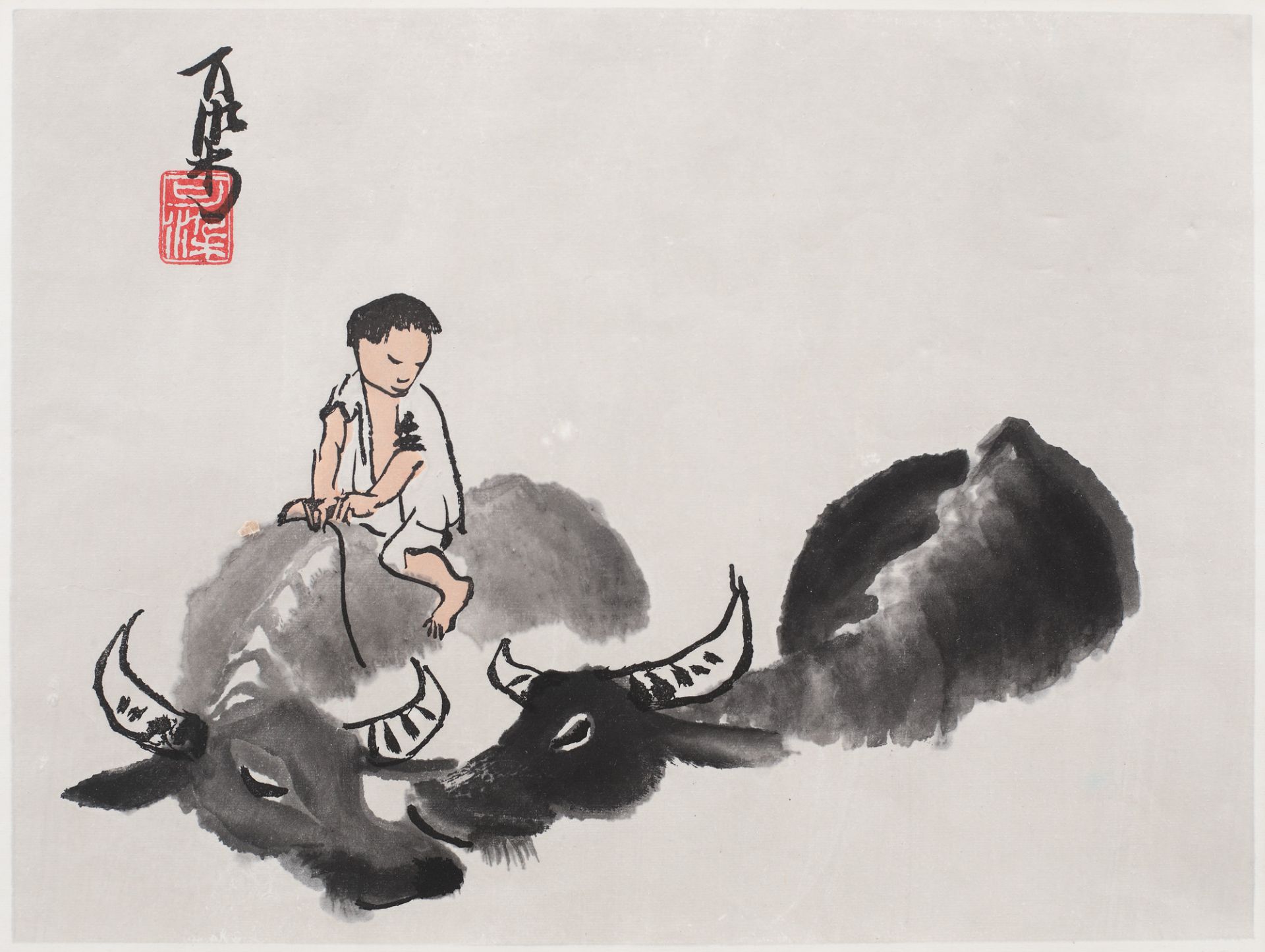 Boy with buffalos bathing