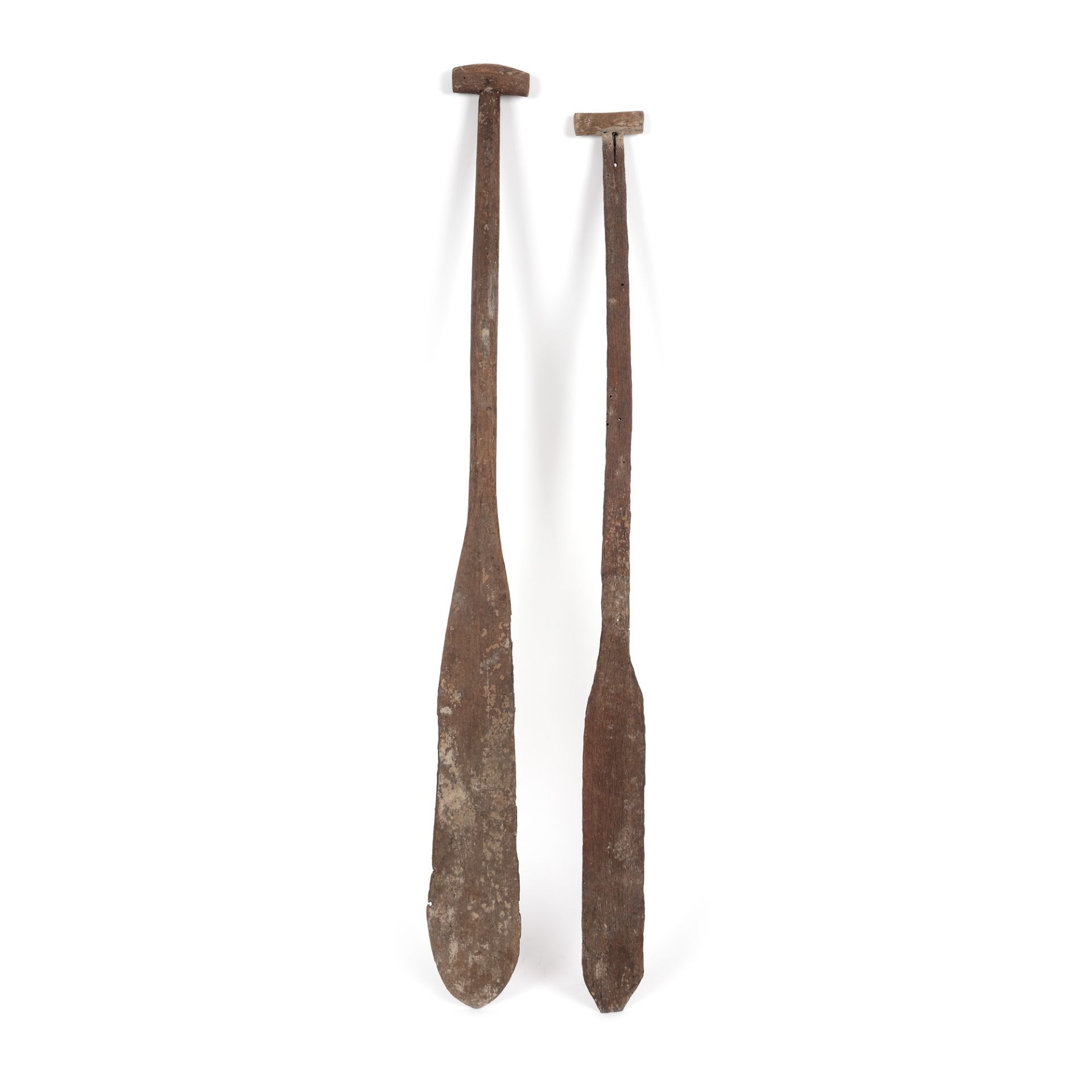 Two exotic wooden oars, possibly Borneo