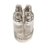 Set of four perfume bottles with silver mounts