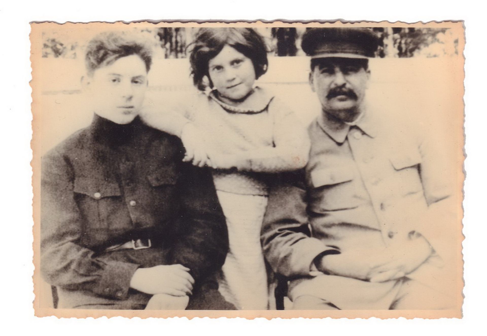 [Soviet]. Joseph Stalin with his daughter Svetlana and son Vasily. Photograph. 1930s. 8x12 cm.<br>Re