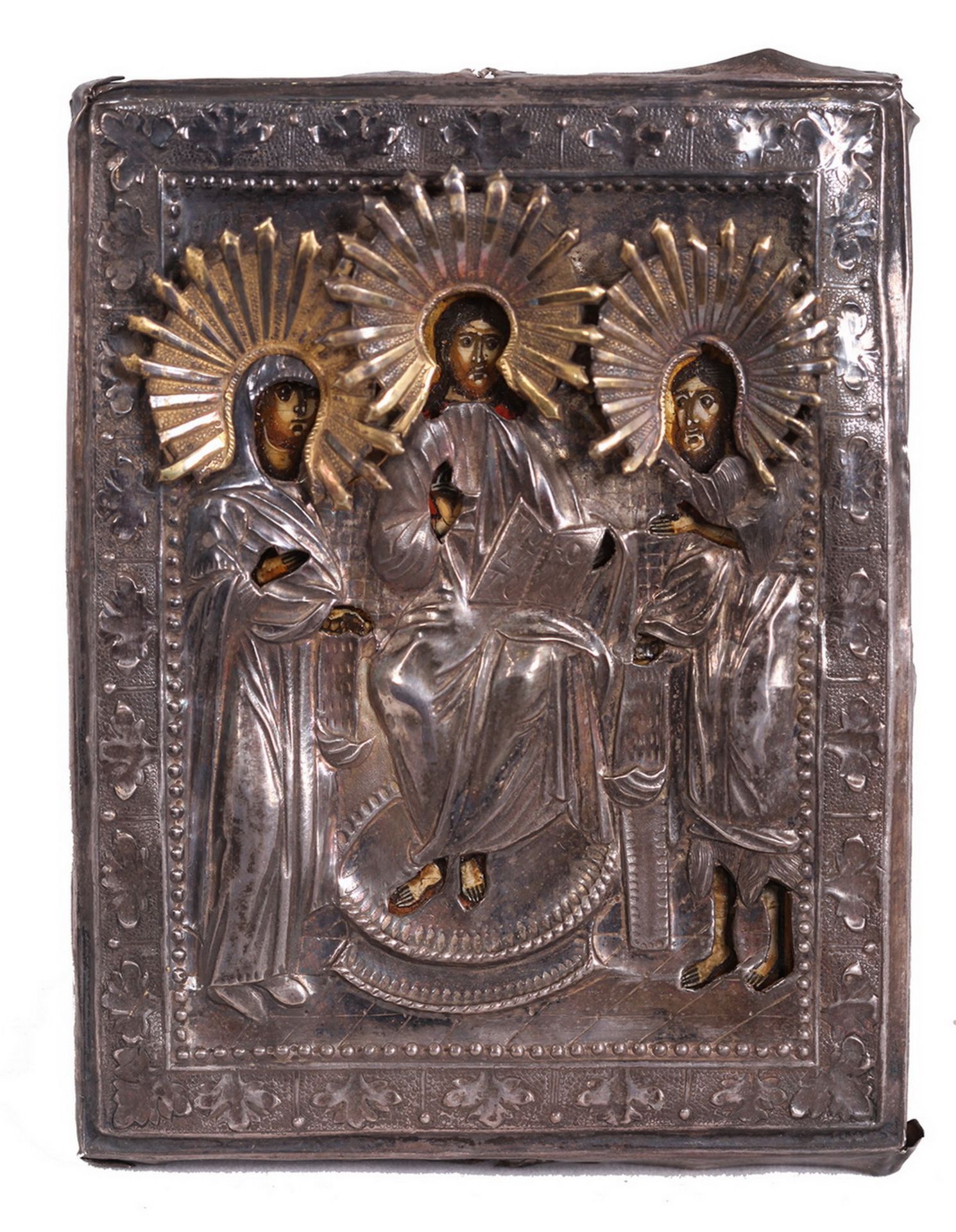 Russian icon "Deisis" with silver oklad. - 19th century; 12x9 cm.<br>Tempera on wood, with gilding, 