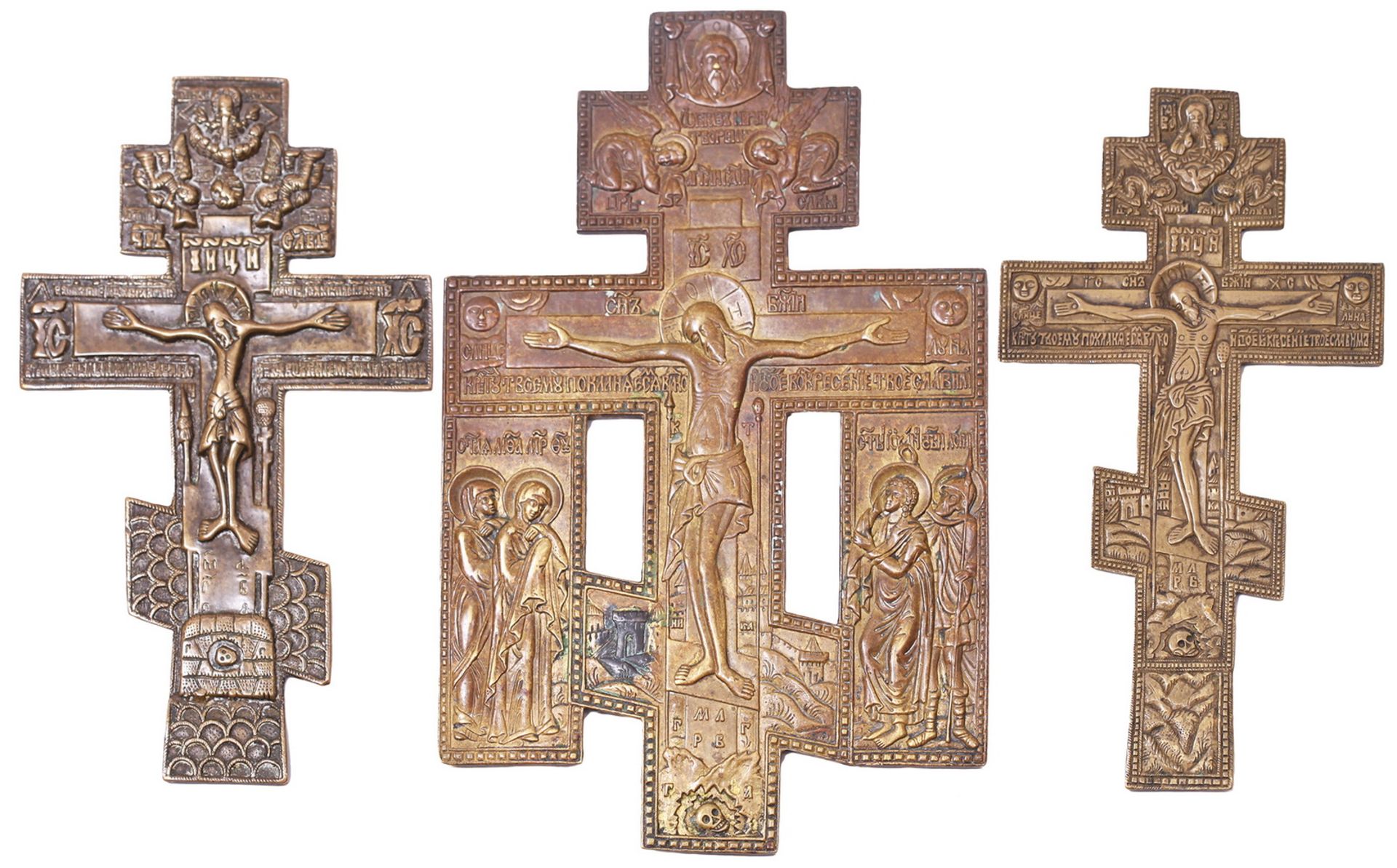 Three brass crucifix. - Russia, 19th century. Size: from 20x11 to 23x15 cm.