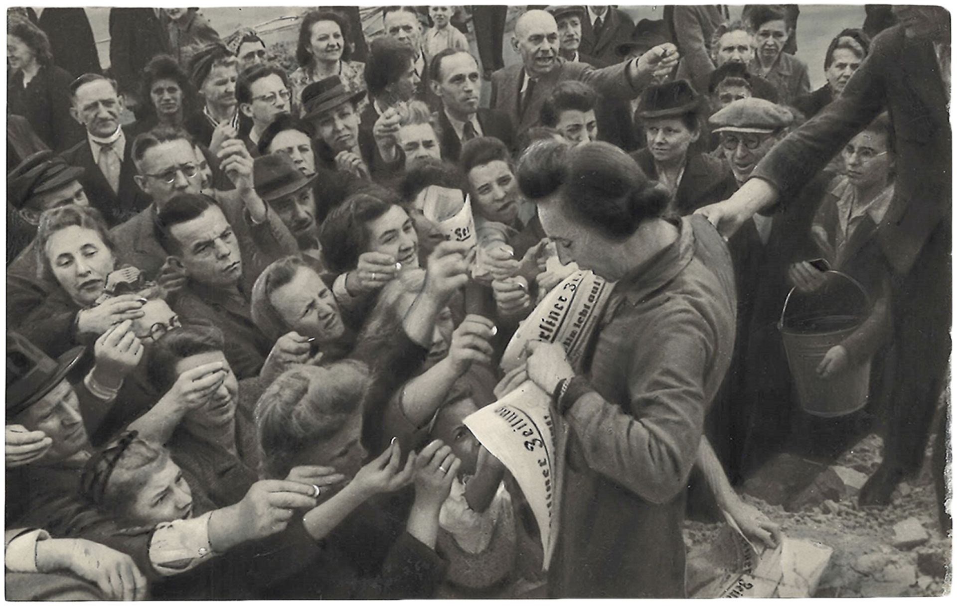 Selling of the first issue of "Berliner Zeitung" newspaper. 1945. Press photo. 10,5x15,5 cm.