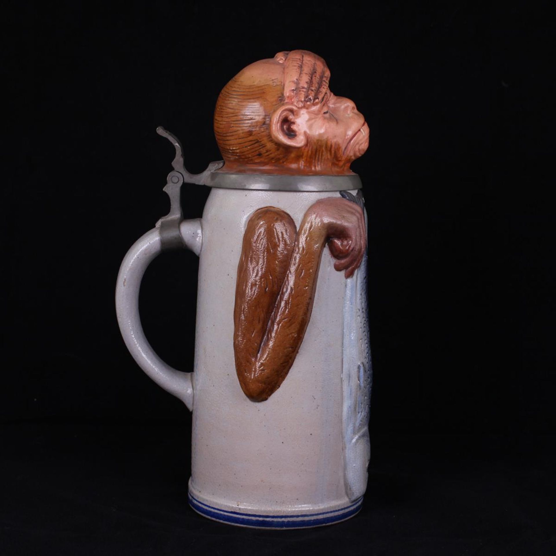 Beer stein with a monkey's head.[1900s].