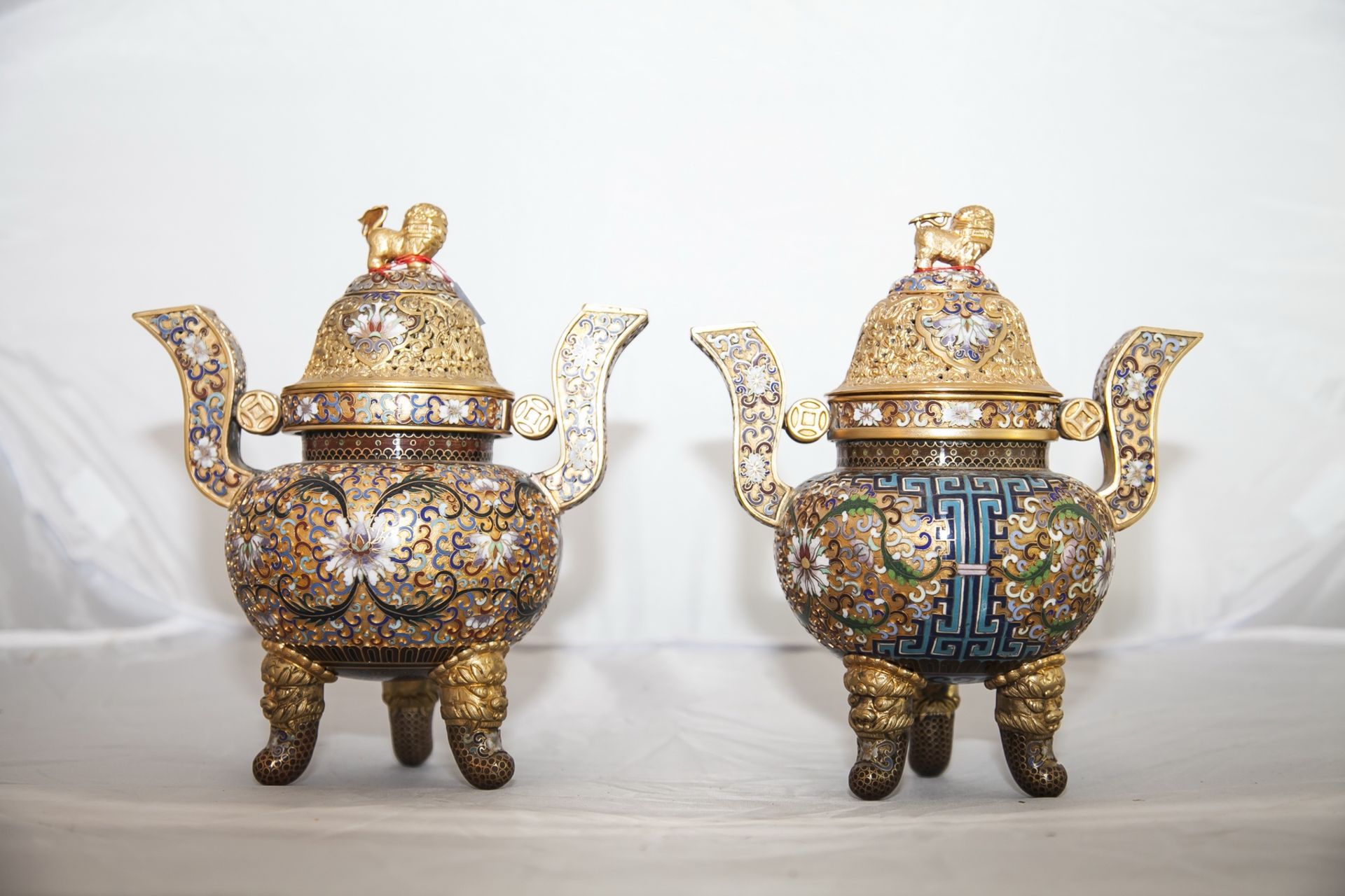 A pair of lidded enamel vases in Chinese style. 19th - 20th century.