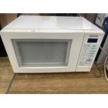 A WHITE PANASONIC MICROWAVE OVEN BELIEVED IN WORKING ORDER BUT NO WARRANTY